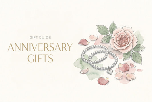 Illustration of two linked silver beaded bracelets with a heart charm beside a blush pink rose and petals