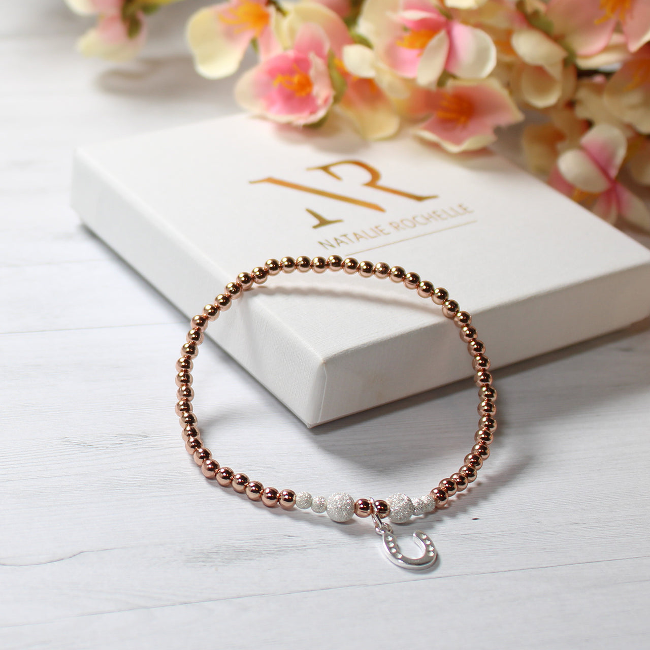Rose Gold beaded Bracelet with sterling silver horseshoe charm